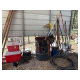 Receiver hitch step, some tires, coolers, and assortment of yard tools