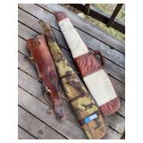 Two soft side rifle cases, and a leather scabbard