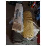 Pile of heavy canvas tarps, and box of plastic sheeting