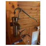 Brass pitcher pump - for decor, bolted to the wall