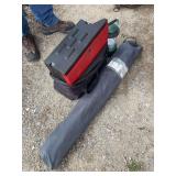 Magnum fabric top portable camp table, propane cook stove, and Coleman battery lantern