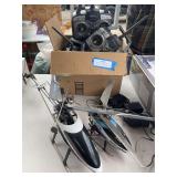 Two remote control helicopters with large box full of remote control controls - unknown working condition