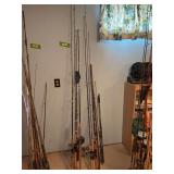 Assorted fishing poles and reels