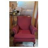 Wine colored arm chair and floor lamp, the perfect reading ensemble.