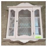 Pink painted curio cabinet