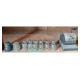 Glass insulators and check writer
