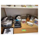 Decorated glass blocks, surge protectors, radio, binoculars, original cell phone, digital picture frame, etc