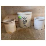 Two unmarked 1 gallon crocks and a 4 gallon Western Stoneware crack w large hairline