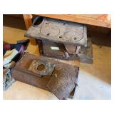 Cast-iron cook stove and additional stove parts, including floral decorated stove door