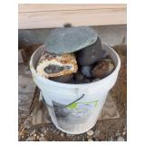 Bucket full of agates and rocks, petrified  wood
