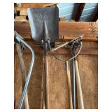 Assortment of yard tools, including nippers, rake, shovel, Matic, hoe