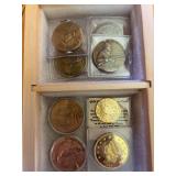 Bronze and gold colored tokens and replica coins
