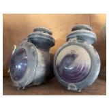 Two carriage lights with purple glass globes