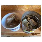 Two containers of petrified wood