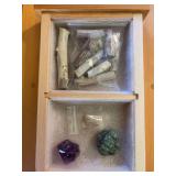 Small pieces of petrified tree branches, crystal, turquoise chunk, and quartz pendants