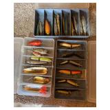 Three assortment bins full of fishing lures