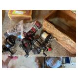 Antique wooden box full of fishing reels