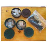Three canisters of fossilized clam shells and John Austin made arrow points