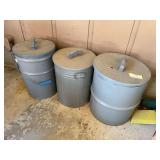 Three metal cans with lids and birdseed