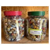 Two jars full of polished stones