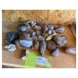 Large group of polished agates and wood