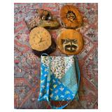 Raccoon wood wall hangings, and two burl wood clocks plus homemade quilted bag