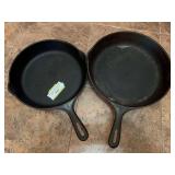 Number 8 and number 10 unmarked cast-iron skillets