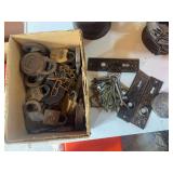 Box of old locks, keys, and door hardware