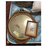 Antique round mirror and feather bird art
