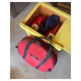 Wooden box with two small gas cans and jumper cable