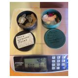 Container of Topaz waterworn pieces and container full of miscellaneous rough cut stones 4.6 ounce total weight  including containers