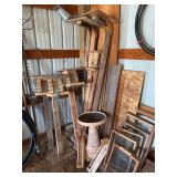 Assortment of bird feeders, rock sifters, birdbath, pedestals for bird nests and t posts