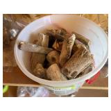 Large bucket full of petrified wood