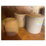 Three small crocks with one lid
