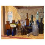 Large assortment of glass bottles, and jars
