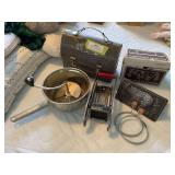 Vintage lunchbox, french fry cutter, bacon press, and egg rings
