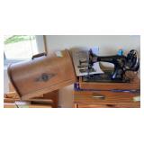 Antique singer portable sewing machine model G7972263 - with hand crank, original wood case with lock and key, and paperwork
