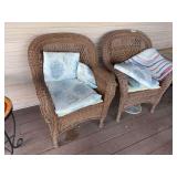 Two plastic wicker chairs