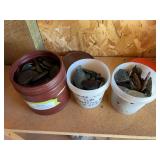 Three small containers, full of jade