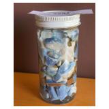 Jar full of Owyhee blue opal?, suspended in oil