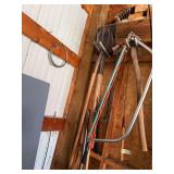 Yard tools, including shovel, fork, saw, large crowbar, single bit ax