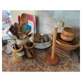 Wood bowls, crock of kitchen utensils, wooden pencil holders, ceramic plates, and platters