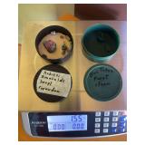 Container of Rubies, Emeralds, Beryl and corundum and two pieces of blue topaz 1.55 ounce total weight  including containers