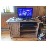 Small flatscreen tv with dvd player and small cabinet