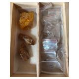 Three chunks of amber and assortment of quartz crystals