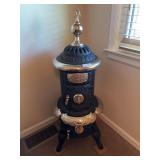 Oak Home Junior Round Stove, has been renickled, 48” tall, beautiful piece, came out of a church in WI