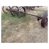 Pair of metal wheels on axles-bring help to load