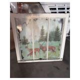 Old window frame with deer art
