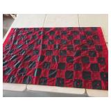 Handmade rag quilt featuring a red and black checkerboard pattern-74x45