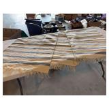 Three blue and cream rugs